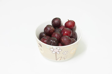 cherry in ceramic bowl