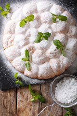 sweet Austrian rolls buchteln with powdered sugar close-up. Vertical top view
