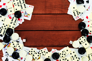 Various board games chess board, playing cards, dominoes. Hobby. Metaphor for games and gambling.