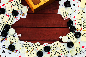 Various board games chess board, playing cards, dominoes. Hobby. Metaphor for games and gambling.