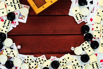 Various board games chess board, playing cards, dominoes. Hobby. Metaphor for games and gambling.
