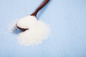 Wooden spoon with sugar