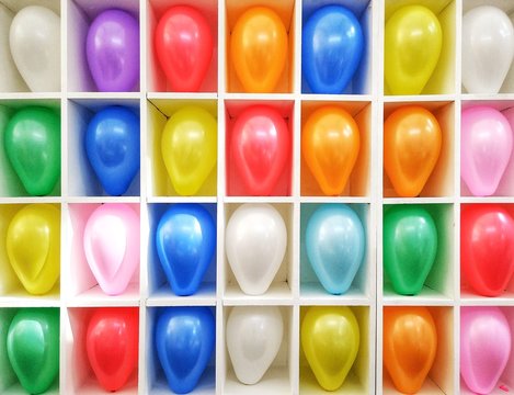 Colorful of balloon background. Amusement throwing darts at balloons.