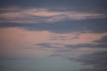 Isolated View of Colorful Shades of Pink, Purple, and Blue Clouds at Sunset