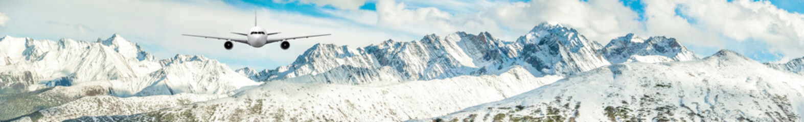 Fototapeta na wymiar Panorama of Airplane frying over the Snow Mountain 