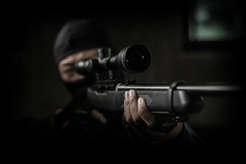 Sniper gun in hand a man,low key style
