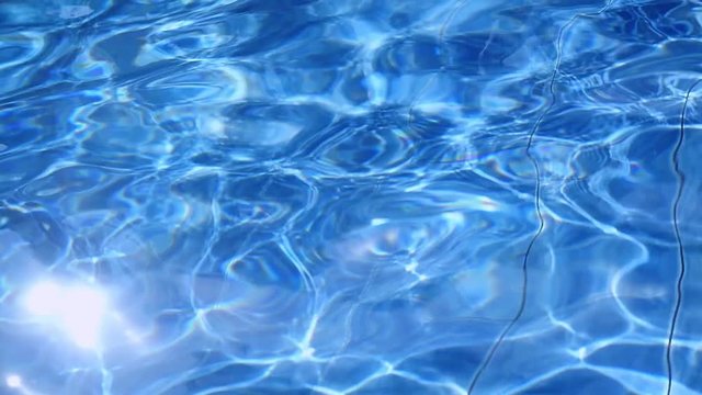 Pool Water Background and sunshine in a swimming pool. Slow motion. 1920x1080