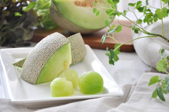 Pieces of Fresh Green Melon Serve on White Plate