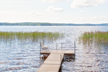 Fototapeta premium Jetty is on lake in summer day