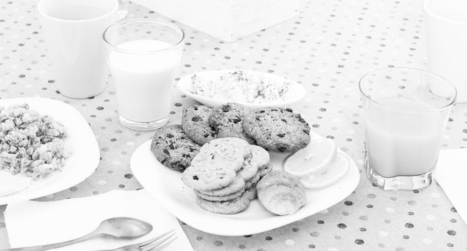 still life of juice, milk, biscuits, porridge from cereals