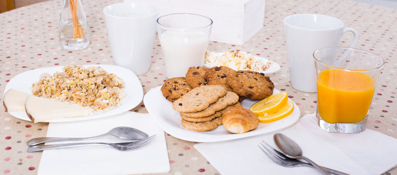 orange juice, milk, biscuits, porridge made of cereal flakes