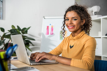 african american woman using laptop