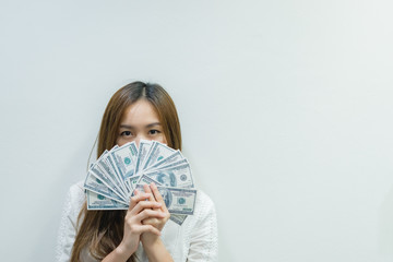 Asian office woman glad from bonus,she has a lot of money from company