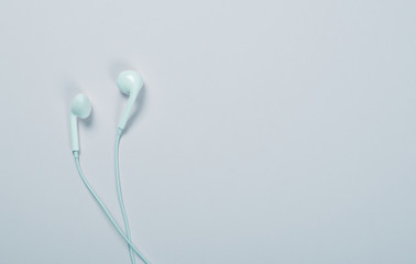 Headphones on blue background. Technology.