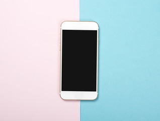 Smartphone on pink and blue background. Technology