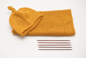 knitting hat by needles for baby