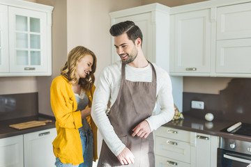  young couple with aprons