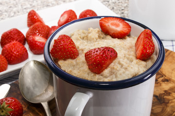 healthy breakfast with porridge and strawberry