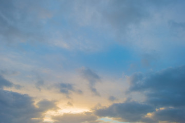 Naklejka na ściany i meble Clouds in a blue sky in sunlight at fall