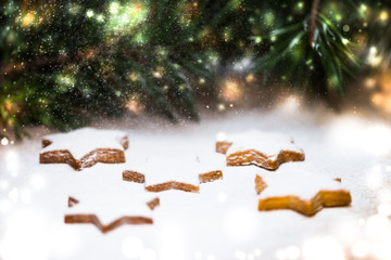 Ginger biscuits and spruce branches. Snow-covered kartika, Christmas warm atmosphere. New Year's and Christmas sketches. Shortbread. Cookies in the form of an asterisk.
