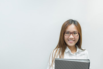 Asian girl wearing glasses with document file on white background,Thai business woman