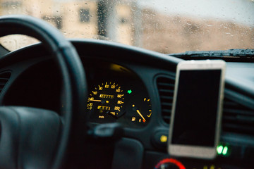 phone on phone holder in the car