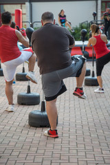 Fat Man in Fitness Class: Workout with Free Standing Boxing Punc