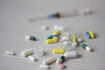 medical ampoule, bottle, pills and syringe