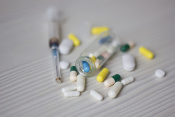 medical ampoule, bottle, pills and syringe