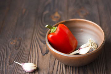 red pepper and garlic on a wooden table