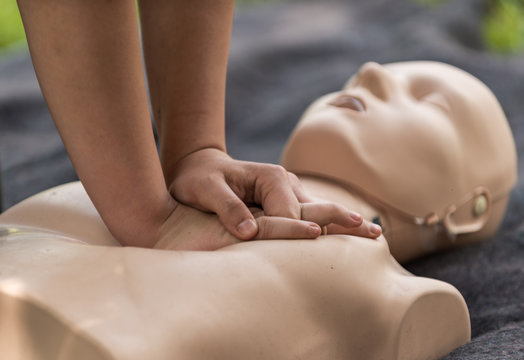 Cpr training outdoors. Reanimation procedure on CPR doll