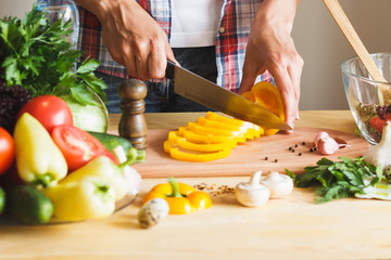 Woman cooks at the kitchen