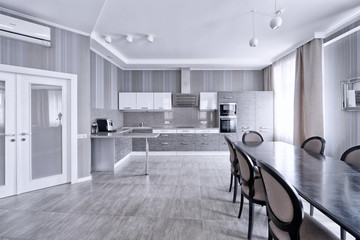 Interior of the kitchen-living room in a modern house.