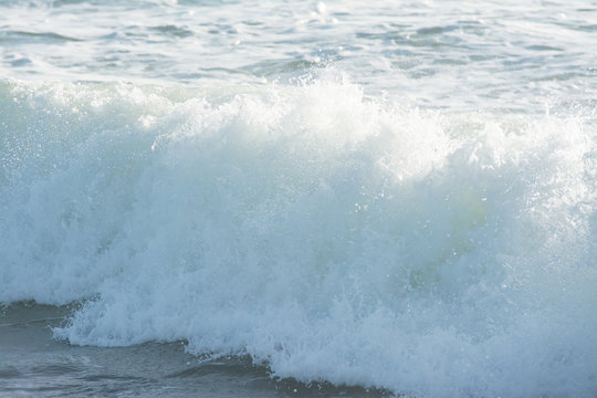 mediterranean sea waves breaking background, green water © puckillustrations
