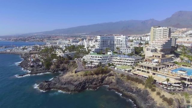 TENERIFE, SPAIN - SEPTEMBER 2016: Tourists enjoy Las Americas Beach. Tenerife is a tourist attraction for european tourists.