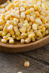 frozen sweet corn on woode surface