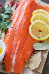 fresh trout fillet on wooden surface