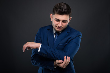 Businessman suffers intense elbow pain