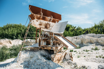Fototapeta na wymiar Equipment for sorting and loading ore in a quarry