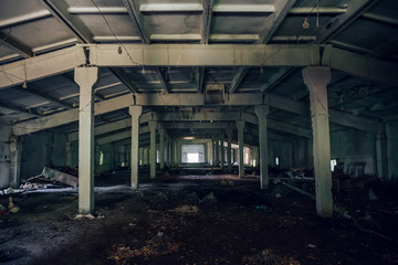 Fototapeta na wymiar Abandoned industrial warehouse interior