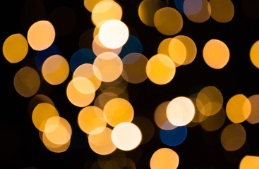 blurred golden lights over dark background