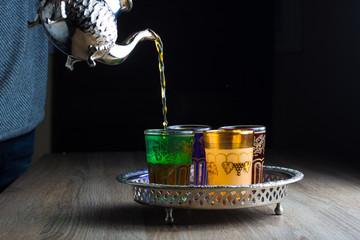 Close-up of traditional Moroccan Tea  - moroccan Teapot and glasses - obrazy, fototapety, plakaty