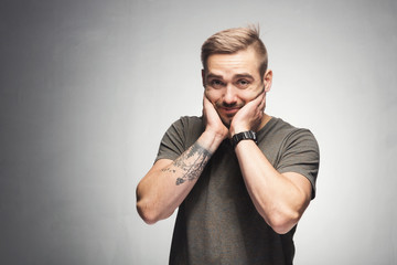 Upset man expressing his confusion.