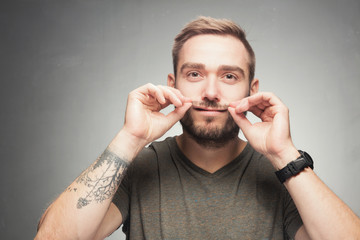 Young man making funny silly face