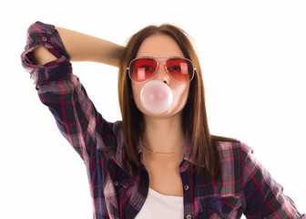 Young cute girl chews bubble gum, isolated  