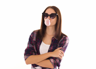 Naklejka premium Young cute girl chews bubble gum, isolated 