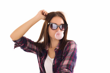 Naklejka premium Young cute girl chews bubble gum, isolated 
