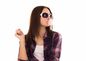 Young cute girl chews bubble gum, isolated  