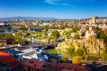 Aerial view from the top on the houses of Old Town of Tbilisi, Kura river and Sameba Cathedral Holy Trinity Georgia © photoaliona
