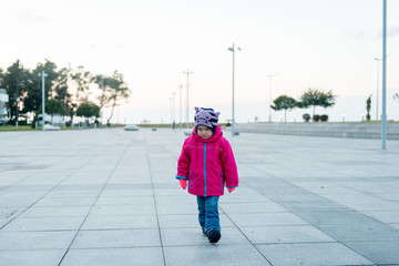 Disgruntled girl walks down the street